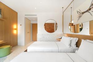 Postel nebo postele na pokoji v ubytování Hotel Milu Milano