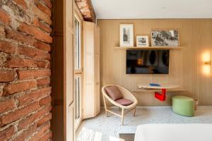 TV a/nebo společenská místnost v ubytování Hotel Milu Milano