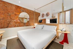 Postel nebo postele na pokoji v ubytování Hotel Milu Milano