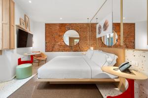 Postel nebo postele na pokoji v ubytování Hotel Milu Milano
