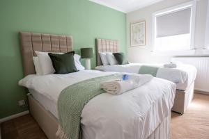 Postel nebo postele na pokoji v ubytování Graham House