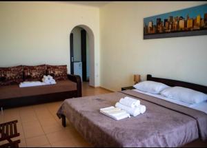 Postel nebo postele na pokoji v ubytování Hotel Olimp