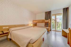 Voodi või voodid majutusasutuse Bepy Hotel Garni toas