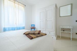 A bed or beds in a room at B&B Artemisia