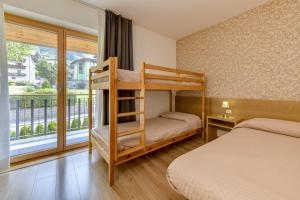 Voodi või voodid majutusasutuse Bepy Hotel Garni toas