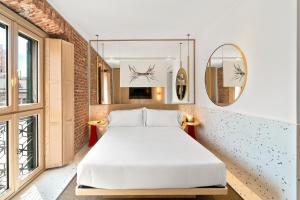 Postel nebo postele na pokoji v ubytování Hotel Milu Milano
