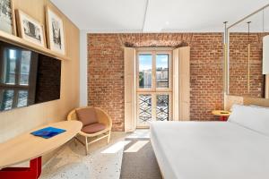 Postel nebo postele na pokoji v ubytování Hotel Milu Milano