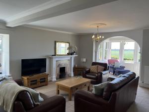 Μια τηλεόραση ή/και κέντρο ψυχαγωγίας στο Vicarsford Farmhouse
