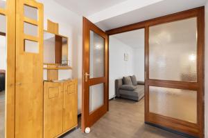 a living room with a door and a chair at Ferienwohnung in Bad Berneck in Bad Berneck im Fichtelgebirge