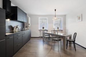 a kitchen with a table and a dining room at Ferienwohnung in Bad Berneck in Bad Berneck im Fichtelgebirge