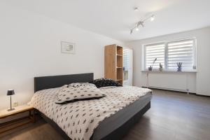 a bedroom with a bed with two pillows on it at Ferienwohnung in Bad Berneck in Bad Berneck im Fichtelgebirge