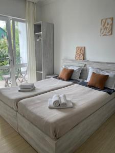 A bed or beds in a room at Guest house Junona
