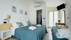 Ένα ή περισσότερα κρεβάτια σε δωμάτιο στο Albergo Villa Denny