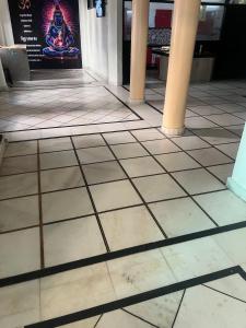 a tiled floor in a building with columns at himalayan siddhi home stay in Rishīkesh