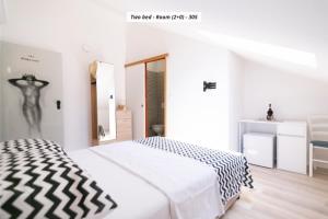 Postel nebo postele na pokoji v ubytování Hotel ROYAL RINA