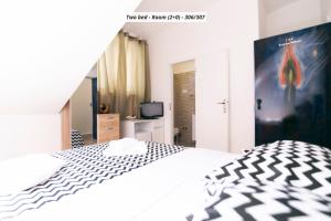 Postel nebo postele na pokoji v ubytování Hotel ROYAL RINA