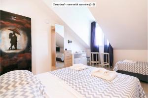 Postel nebo postele na pokoji v ubytování Hotel ROYAL RINA