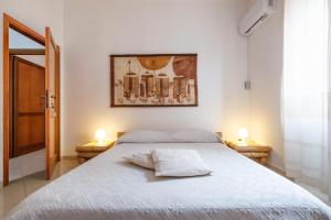 Postel nebo postele na pokoji v ubytování B&B Artemisia