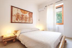 A bed or beds in a room at B&B Artemisia