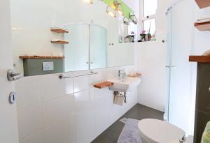 a bathroom with a shower and a sink and a toilet at Apartments Marmont in Split +48 photos