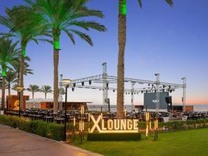 a view of a stage with palm trees at Rixos Sharm El Sheikh - Adults Only 18 Plus in Sharm El Sheikh