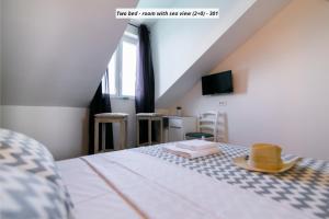 Postel nebo postele na pokoji v ubytování Hotel ROYAL RINA