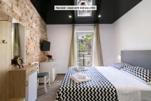 Postel nebo postele na pokoji v ubytování Hotel ROYAL RINA