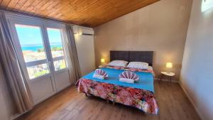 Ένα ή περισσότερα κρεβάτια σε δωμάτιο στο Apartments Rose