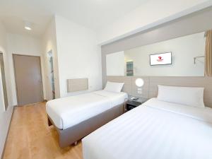 Postelja oz. postelje v sobi nastanitve Red Planet Ortigas