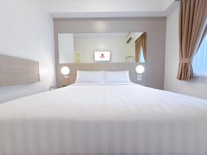 Postelja oz. postelje v sobi nastanitve Red Planet Ortigas