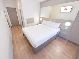 Postelja oz. postelje v sobi nastanitve Red Planet Ortigas