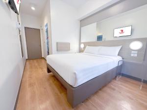 Postelja oz. postelje v sobi nastanitve Red Planet Ortigas