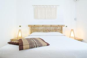 A bed or beds in a room at B&B Artemisia
