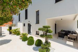 a courtyard of a house with a living room at Villa Verana with pool in Savudrija