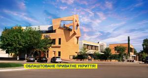 a building with a sculpture on the side of it at Uliss in Odesa
