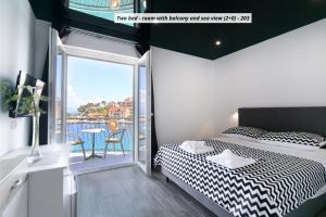 Postel nebo postele na pokoji v ubytování Hotel ROYAL RINA
