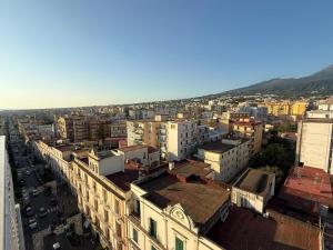 an aerial view of a city with buildings at Panoramic Tower in Torre del Greco