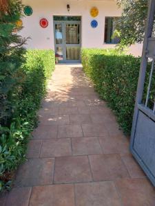 a walkway in front of a house with a door at CasaDeA in Atri
