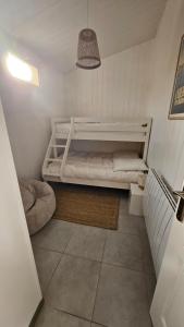 a small room with a bed and a staircase at Maison sur bassin d arcachon in Lanton