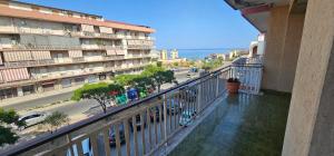 a balcony of a building with a view of a street at Miramare72 in Crotone