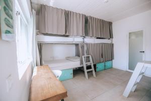 A bed or beds in a room at The Tree House Tenerife