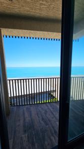 a view of the ocean from the balcony of a condo at Bristol in Kvariati