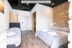 Postel nebo postele na pokoji v ubytování Hotel ROYAL RINA