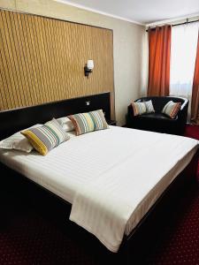Voodi või voodid majutusasutuse Nowad Hotel toas