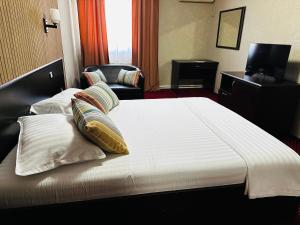 Voodi või voodid majutusasutuse Nowad Hotel toas
