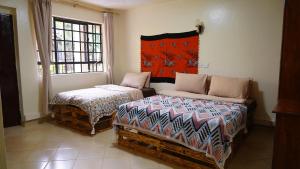 Postel nebo postele na pokoji v ubytování ZZZ hostel Nairobi