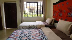 Postel nebo postele na pokoji v ubytování ZZZ hostel Nairobi