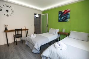 A bed or beds in a room at The Tree House Tenerife