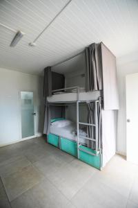 A bed or beds in a room at The Tree House Tenerife