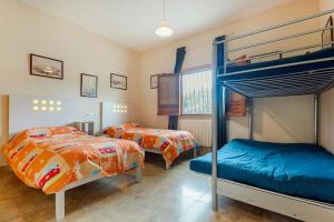 a bedroom with two beds and a bunk bed at Villa Rancallosa con barbacoa, wifi y piscina privada in Relleu +22 photos
